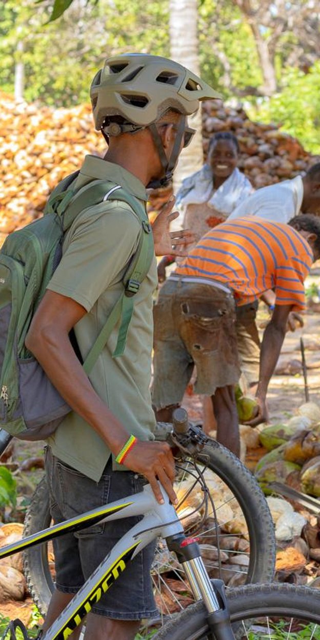 a paddle boarder on the water with the sunset in the background